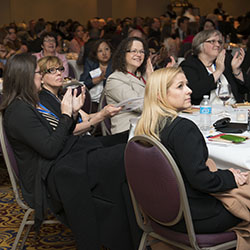 Participants at IEL's 50th Anniversary Celelbration applaude.